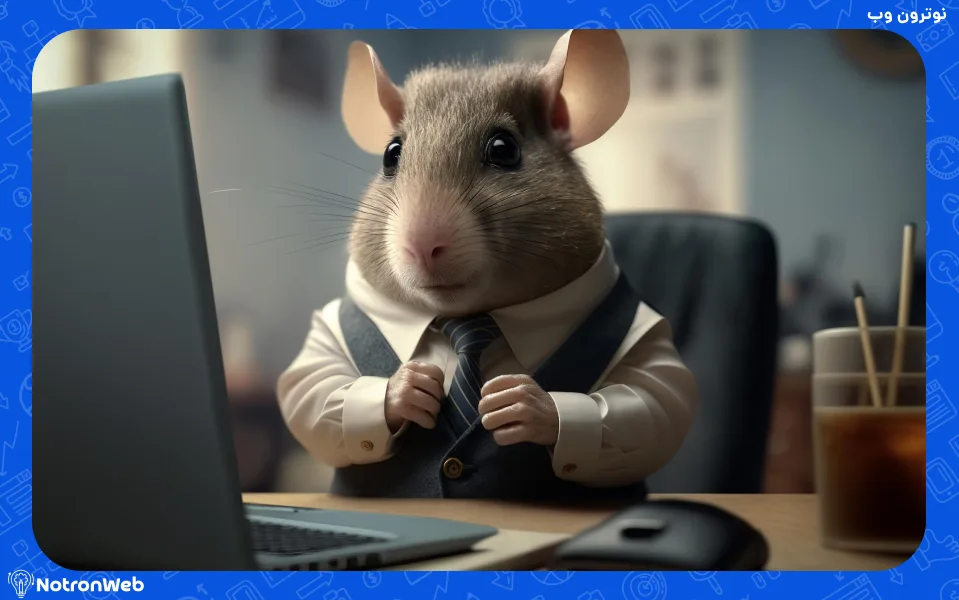 یک موش پشت میز کاری و لپ تاپ